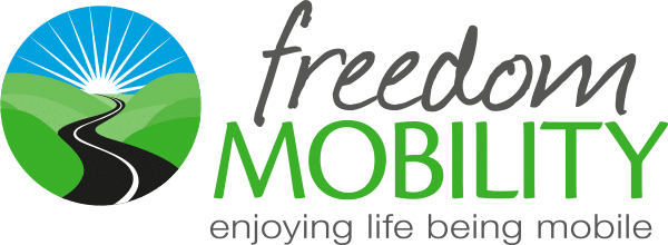 The Freedom Mobility logo. It is a black road winding through green hills towards a blue sky with a white sun on the horizon. Beside it is “Freedom Mobility” and beneath that is the slogan: “Enjoy life being mobile”