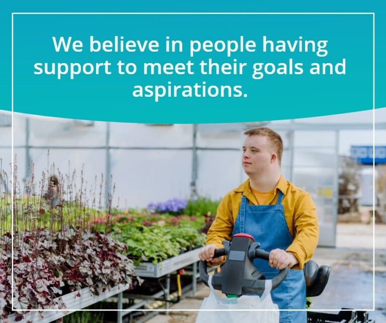 Promotional material for Accessible Properties. It is a photo of a man with down syndrome in a yellow shirt and overalls on a mobility scooter. The heading above him reads "We believe in people having the support to meet their goals and aspirations"